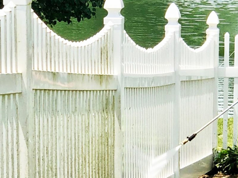 Power washing of fence in progress